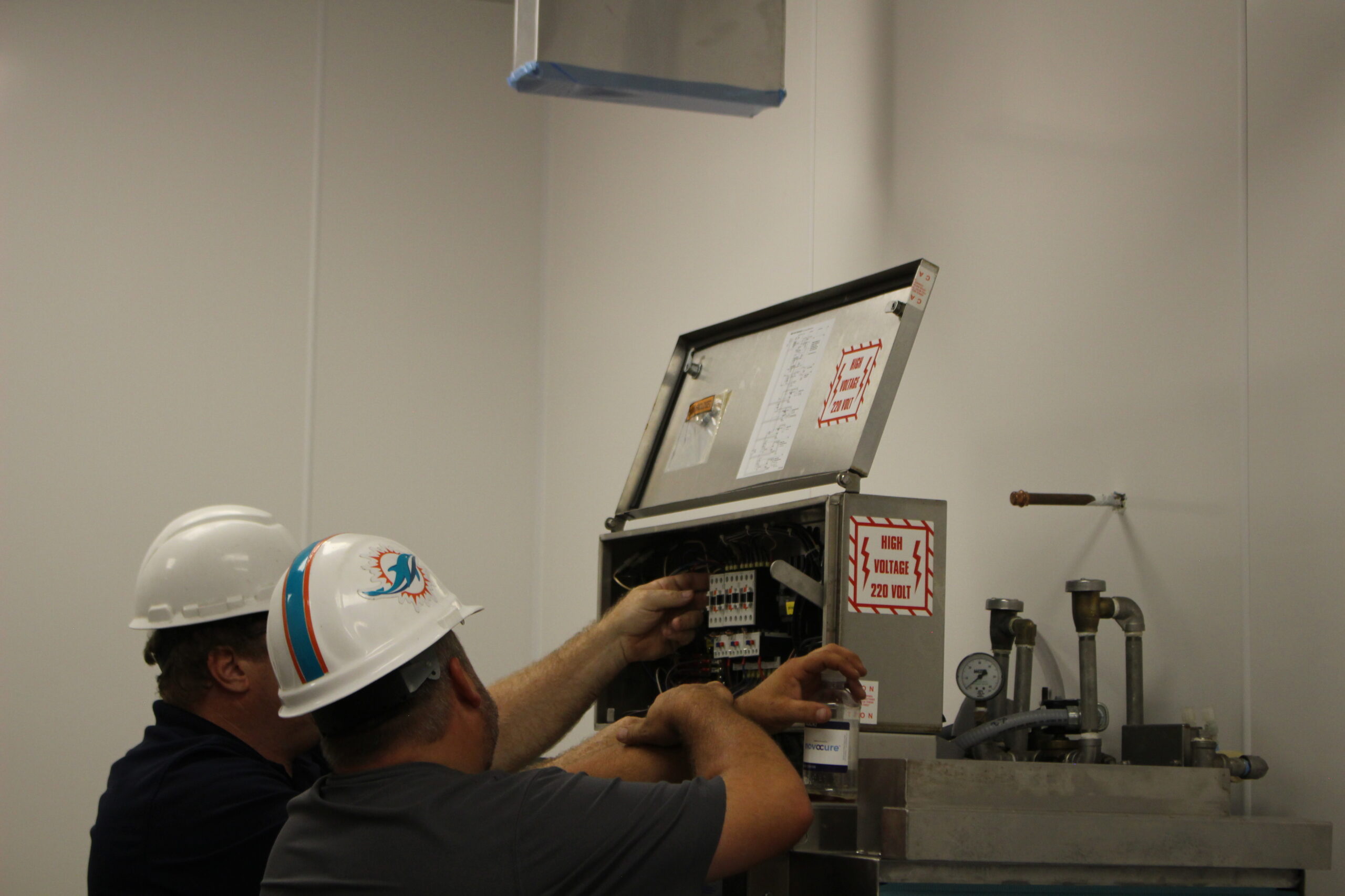 Summit Supply technician servicing commercial dishmachine.